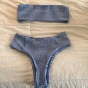 Blue High-waisted bikini bottoms and bandeau top.